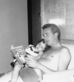 Denise Shubin as a child with her father reading The Dancing Princess for her