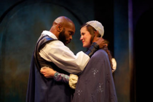 Othello (Forrest McClendon) puts his whole focus on Desdemona (Lauren Sowa) as they greet each other upon his arrival in Cyprus in the Philadelphia Shakespeare Theatre production of Othello. Photo by Chris Miller, Philadelphia Shakespeare Theatre.