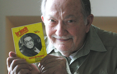Walt Vail holding a playbill of his recent work Branch.  Photo by Tim Hawk.