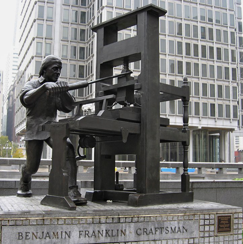 Benjamin Franklin with a printing press. Statue near City Hall, Philadelphia.