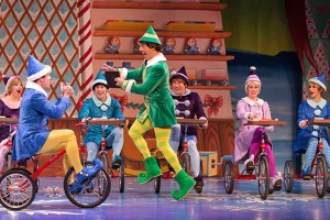 Christopher Sutton as Buddy, with a supporting ensemble of elves, in the Walnut Street Theatre’s ELF (Photo credit: Mark Garvin)