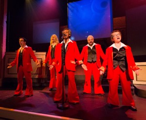 The ensemble (Dave Jadico, Alex Bechtel, Aimé Donna Kelly, Scott Greer, and Jennifer Childs) plays “The Spinners” in 1812 Productions’ THIS IS THE WEEK THAT IS (Photo credit: Mark Garvin)