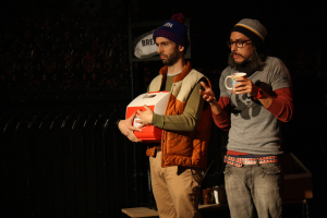 J Hernandez right, with Dave Johnson) in We Can All Agree to Pretend this Never Happened in Tiny Dynamite’s A Play, A Pie and A Pint, October 2014 (Photo credit: Ilana Caplan)