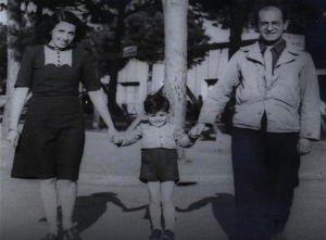 Lily and Fredl Spitz holding their son Roberto at the displaced persons' camp in Cinecittà, Italy, 1945. Ironically, Italy's largest film city was constructed during the Fascist era as part of a scheme to revive their film industry, but was taken over by the Allies as a displaced persons' camp after World War II. 