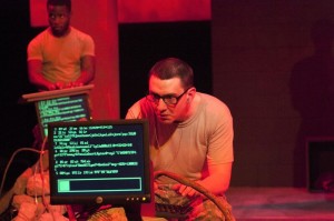 Johnny Smith (in front) with David Glover (behind) in Inis Nua Theatre Company's THE RADICALISATION OF BRADLEY MANNING (Photo credit: Katie Reing)