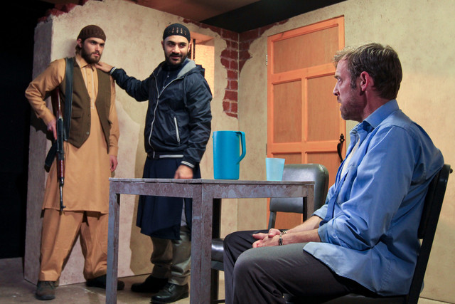 Anthony Mustafa Adair (left) with Maboud Hamidzadeh and Ian Merrill Peakes in THE INVISIBLE HAND. Photo by Paola Nogueras.