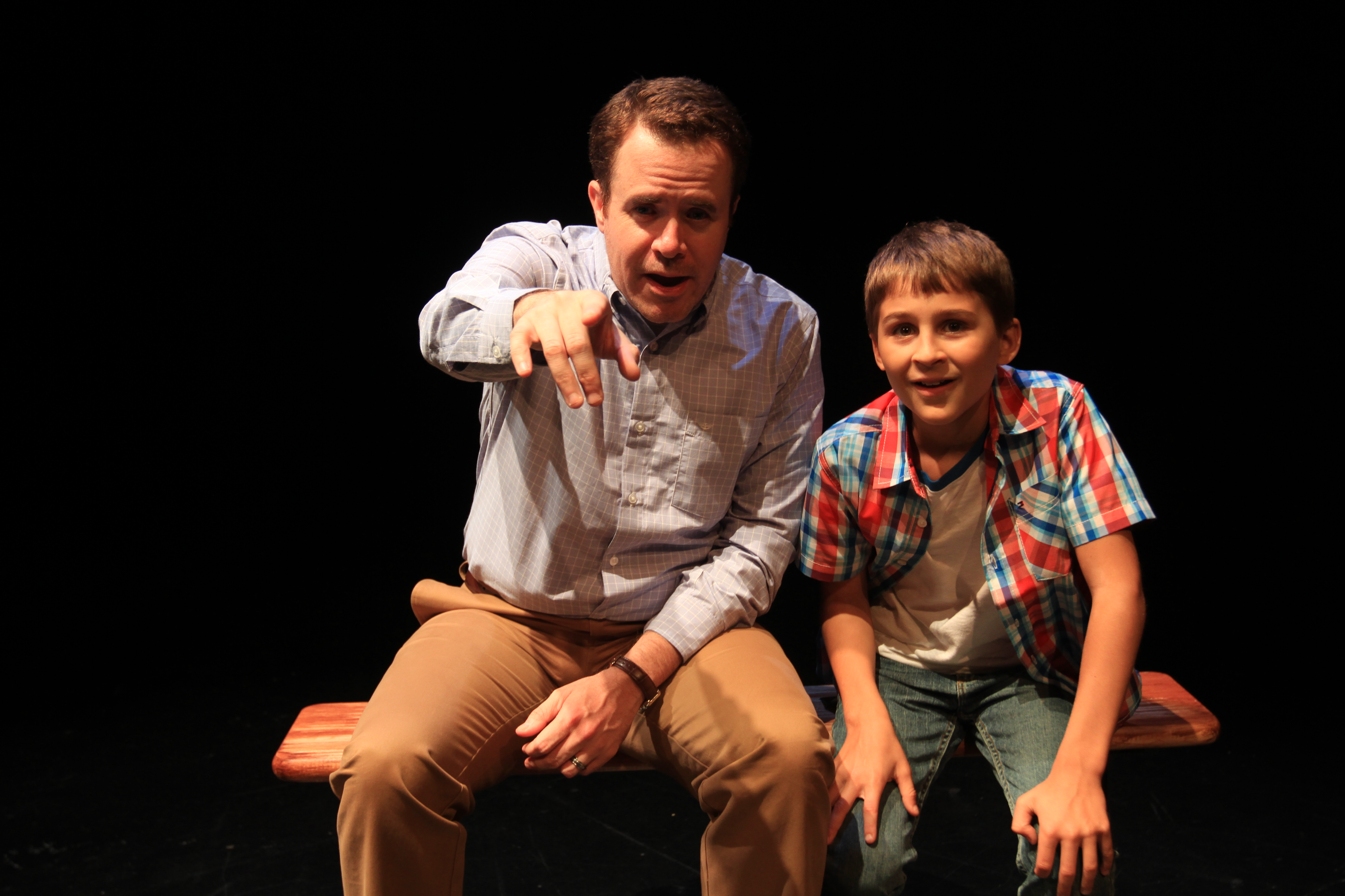 Young Ray Didinger (Simon Canuso Kiley) and older version of himself (Matt Pfeiffer) walk down memory lane in TOMMY & ME. Photo by Paola Nogueras.