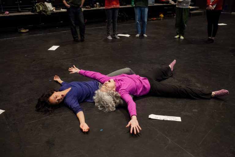 Two of several performers who spend some time on the floor during Michael Kiley's music-movement "experience" Close Music for Bodies. Photo by Adachi Pimentel.